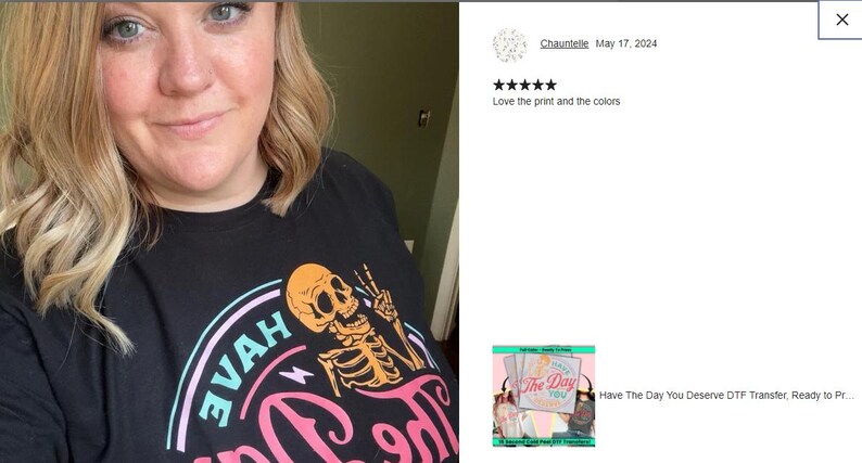 a woman wearing a black shirt with a skeleton on it