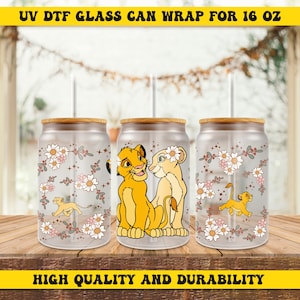 May include: Three clear glass 16 oz. cans with bamboo lids and straws. Each can has a design featuring Simba and Nala from The Lion King, surrounded by white daisies and greenery. The text "UV DTF GLASS CAN WRAP FOR 16 OZ" is at the top of the image and "HIGH QUALITY AND DURABILITY" is at the bottom.