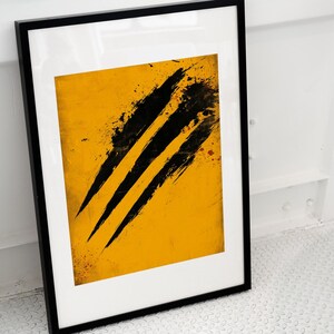 May include: A framed print featuring a vibrant yellow background with three bold, diagonal black brushstrokes that resemble claw marks. The artwork is encased in a simple, thin black frame, creating a sharp contrast between the dark lines and the bright yellow surface.