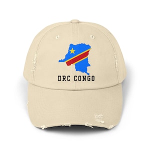 May include: A beige distressed baseball cap featuring an outline of the Democratic Republic of the Congo in the shape of the country's flag with the text "DRC CONGO" underneath.