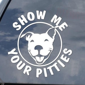 May include: White vinyl decal with a circle containing a smiling pit bull silhouette and the text "Show Me Your Pitties".
