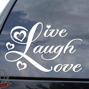 May include: White vinyl decal with the words "Live Laugh Love" in a cursive font. The decal has three small hearts around the words.