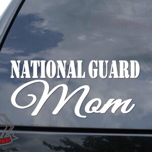 May include: White vinyl decal with the text "National Guard Mom" in a bold, blocky font. The word "Mom" is in a cursive font.