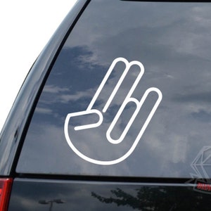 May include: White vinyl decal of a hand making the 'shocker' gesture. The decal is on a dark blue car window.