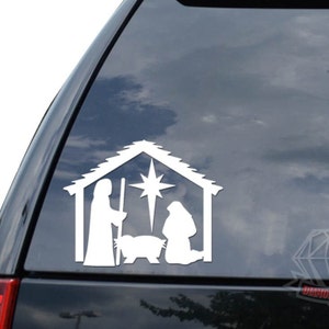 May include: White silhouette of the nativity scene with Mary, Joseph, and baby Jesus in a manger with a star above them.