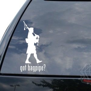 May include: White vinyl sticker of a bagpipe player with the text "got bagpipe?" on a car window.