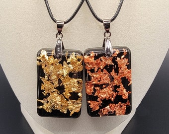 Bling It - handmade resin pendant necklace  with a touch of bling from gold foil flakes against a dark background