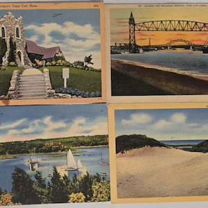 May include: Set of four vintage postcards featuring scenic views of Cape Cod, Massachusetts. Includes images of a church, a bridge over water, a harbor with sailboats, and sand dunes under a blue sky.