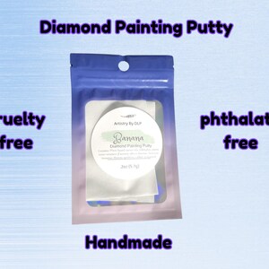 May include: A package of "Diamond Painting Putty" in a clear and blue pouch. The label reads "Banana" and "Artistry By DLP". The package also states "cruelty free", "phthalate free", and "handmade".