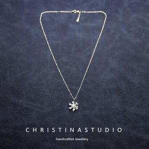 Collar de plata de ley 925 con copos de nieve giratorios para mujer