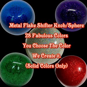May include: Five different coloured metal flake shifter knobs or spheres. The colours are blue, silver, green, red, and purple. The text on the image reads "Metal Flake Shifter Knob/Sphere 28 Fabulous Colours You Choose The Colour We Create it. (Solid Colours Only)"