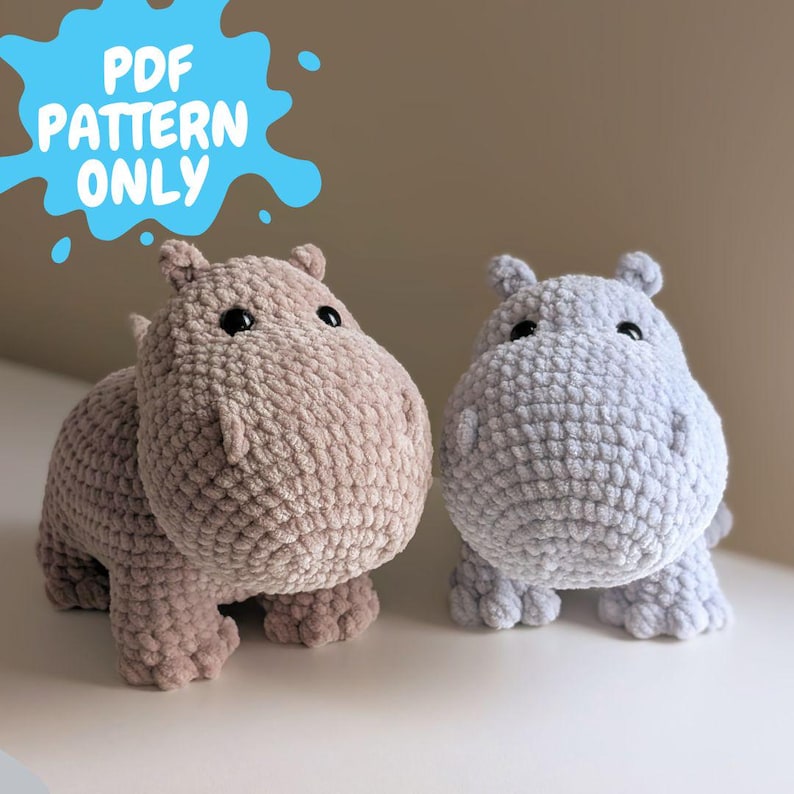 May include: Two crocheted hippopotamus toys. One is light brown and the other is light blue.