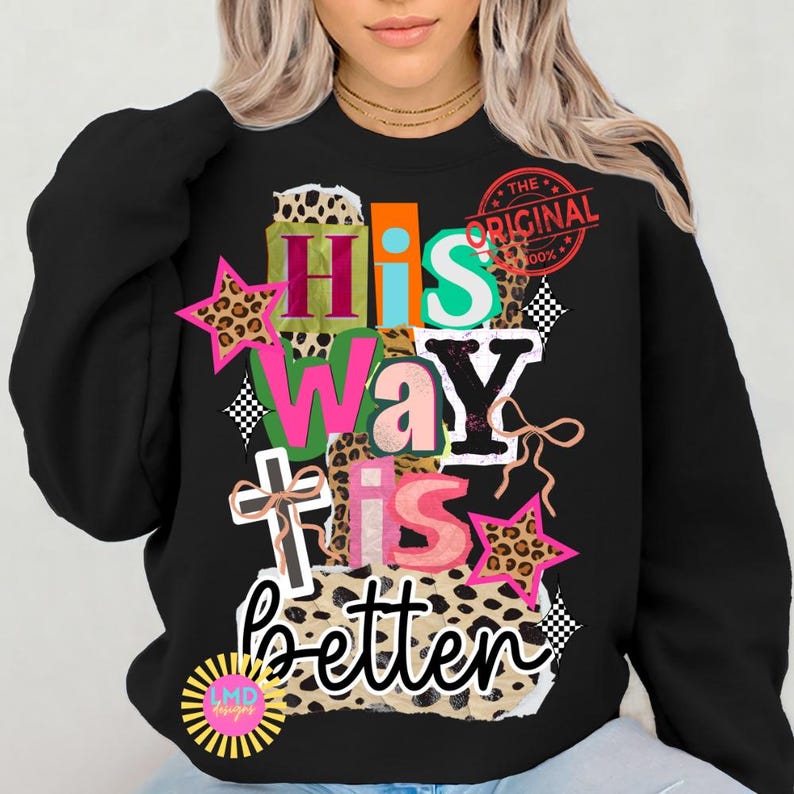 May include: Black sweatshirt with the text "His Way Is Better" in a colorful, layered design. The design includes leopard print, stars, and a cross. A red stamp reads "The Original".