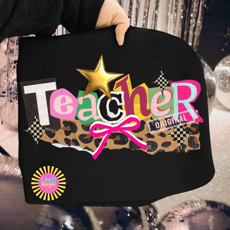 May include: Black tote bag with the word "Teacher" in a colorful, cut-out style. Features a gold star, a pink bow, and a leopard print section. The word "ORIGINAL" is also visible.