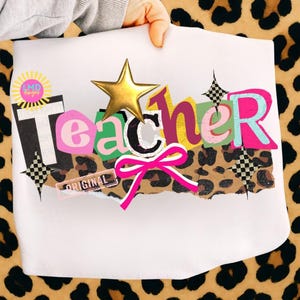 May include: A white sheet with the word "Teacher" in colorful, layered letters, a gold star, and a pink bow. The word "ORIGINAL" is printed on a small rectangular label. The background is a leopard print.