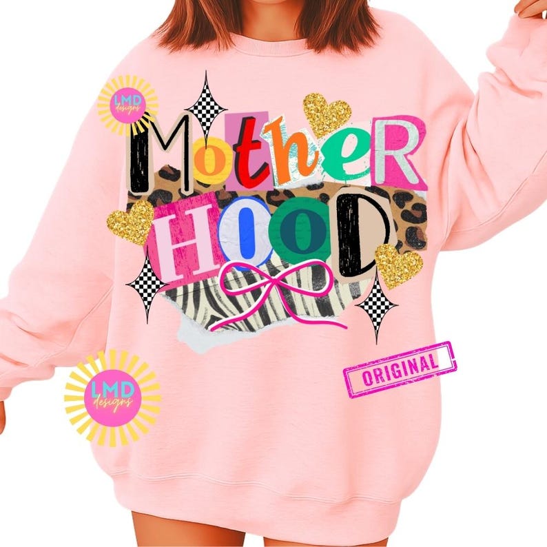 May include: A light pink sweatshirt with the word "Motherhood" in a collage design. The design includes leopard print, zebra print, gold glitter hearts, and a pink bow. The word "Original" is stamped on the bottom right.