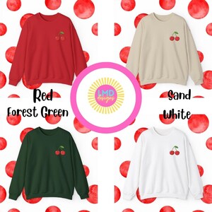 May include: Four sweatshirts with a cherry graphic on the front. The sweatshirts are in red, forest green, sand, and white.