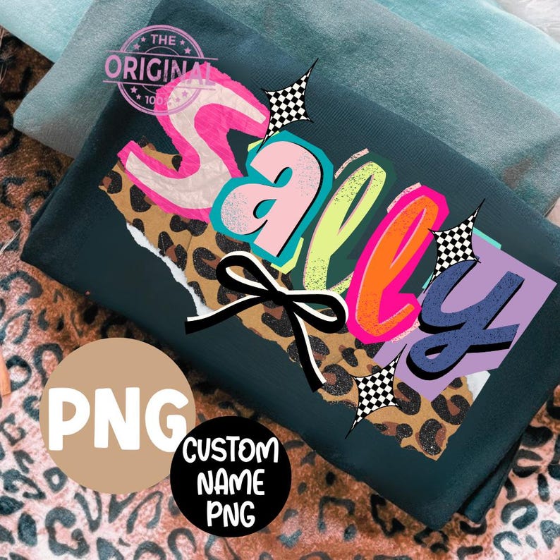 May include: Dark green t-shirt with the word "Sally" in a colorful, layered design. The design includes a leopard print, a black bow, and checkered starbursts. The shirt also has a "PNG" graphic and a "Custom Name PNG" graphic.