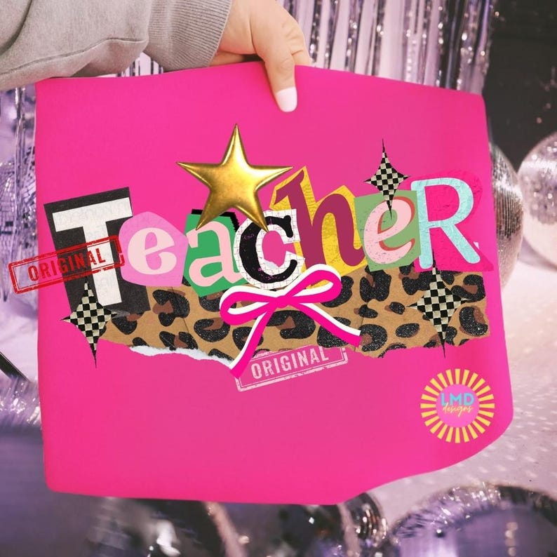 May include: A bright pink tote bag with the word "Teacher" in a collage style. The design includes a gold star, leopard print, a pink bow, and the word "Original" stamped on it. The bag has the LMD Designs logo.