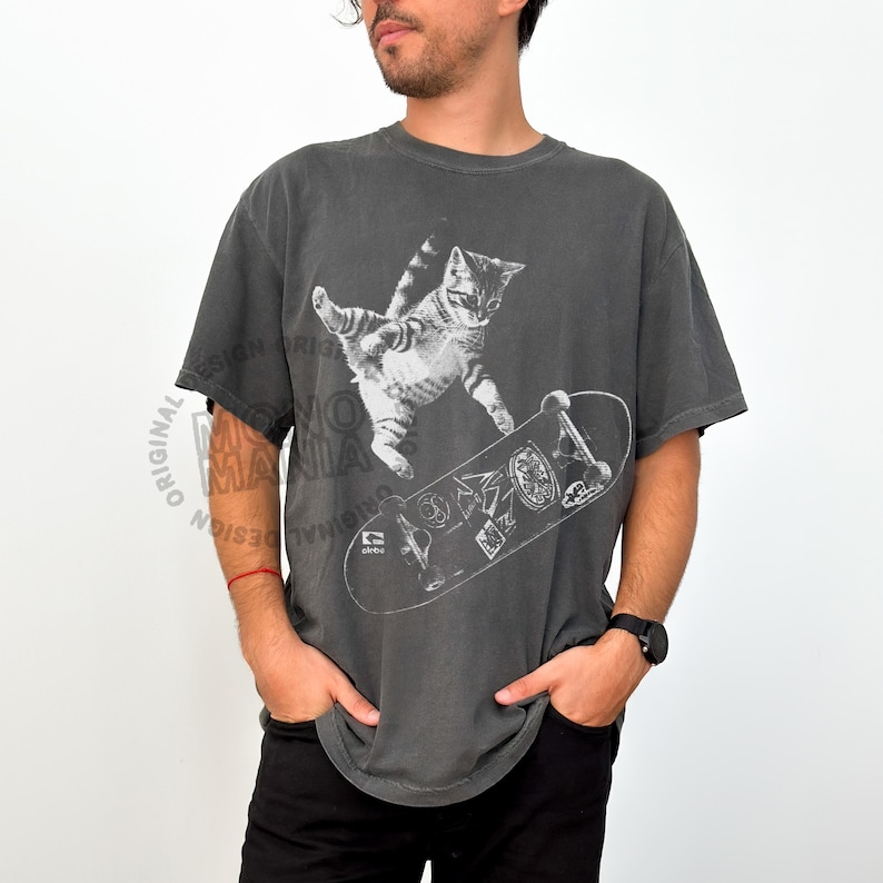 skateboarding cat shirt, retro cat graphic tee, vintage kitten tshirt, punk streetwear top, funny cat skate tee, oversized unisex shirt, cool beer cat tshirt, y2k skater aesthetic, 90s retro cat shirt, grunge coquette tee, rockstar gf cat top, mori kei skate shirt, streetwear cat graphic