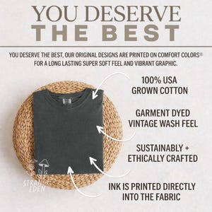 May include: A dark gray t-shirt with a crew neckline. Text on the image reads: YOU DESERVE THE BEST, 100% USA GROWN COTTON, GARMENT DYED VINTAGE WASH FEEL, SUSTAINABLY + ETHICALLY CRAFTED, INK IS PRINTED DIRECTLY INTO THE FABRIC, and STRANGE EDEN.