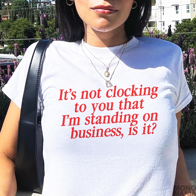 Y2K It's Not Clocking To You That I'm Standing On Business Baby Tee Viral Quote Fitted Top Baddie Aesthetic Shirt Funny Meme Tee TikTok Meme