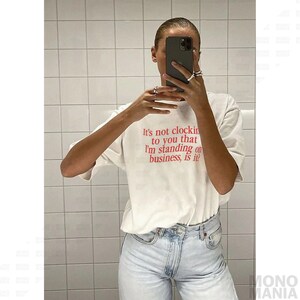 Y2K It's Not Clocking To You That I'm Standing On Business Baby Tee Viral Quote Fitted Top Baddie Aesthetic Shirt Funny Meme Tee TikTok Meme
