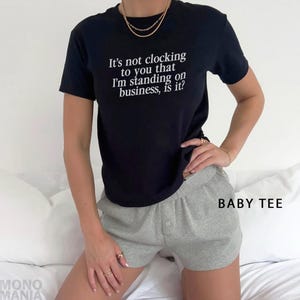 Y2K It's Not Clocking To You That I'm Standing On Business Baby Tee Viral Quote Fitted Top Baddie Aesthetic Shirt Funny Meme Tee TikTok Meme