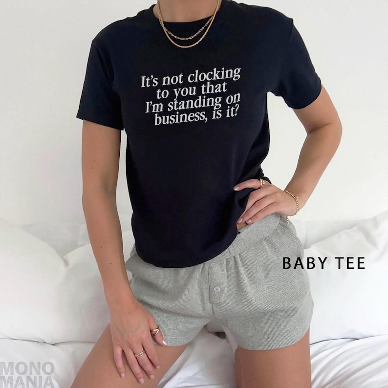 Y2K It's Not Clocking To You That I'm Standing On Business Baby Tee Viral Quote Fitted Top Baddie Aesthetic Shirt Funny Meme Tee TikTok Meme
