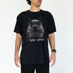 I Have Rabies shirt,
Bat t-shirt,
Funny sarcasm tee,
Unhinged Meme,
Weird Dark Humor,
Grunge Y2k shirt,
rabies hoodie,
i have rabies hoodie,
rabies sweatshirt,
i have rabies tee,
i have rabies tshirt,
i have rabies top,
possum meme
