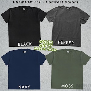 May include: A color chart of premium comfort tees in black, pepper, navy, and moss green. The text "PREMIUM TEE - Comfort Colors" is at the top. The text "COLOR CHART Made to Order" is in the center.