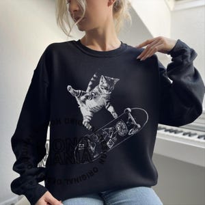 skateboarding cat shirt, retro cat graphic tee, vintage kitten tshirt, punk streetwear top, funny cat skate tee, oversized unisex shirt, cool beer cat tshirt, y2k skater aesthetic, 90s retro cat shirt, grunge coquette tee, rockstar gf cat top, mori kei skate shirt, streetwear cat graphic