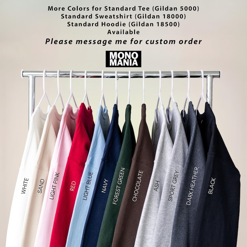 May include: A rack of Gildan brand sweatshirts and hoodies in various colors, including white, sand, light pink, red, light blue, navy, forest green, chocolate, ash, sport grey, dark heather, and black. The brand name "MONO MANIA" is displayed.