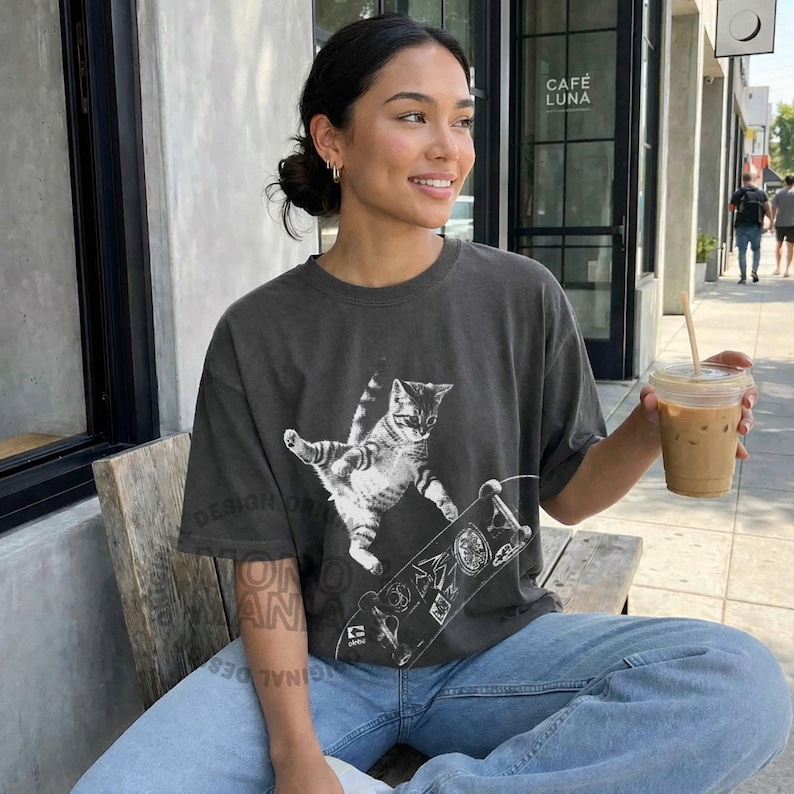 skateboarding cat shirt, retro cat graphic tee, vintage kitten tshirt, punk streetwear top, funny cat skate tee, oversized unisex shirt, cool beer cat tshirt, y2k skater aesthetic, 90s retro cat shirt, grunge coquette tee, rockstar gf cat top, mori kei skate shirt, streetwear cat graphic