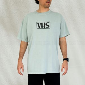 vhs shirt,
nostalgic shirt,
nostalgic tee,
90s shirt,
80s shirt,
movie fan gift,
movie fan shirt,
horror movie shirt,
vintage shirt,
cinephile hoodie,
y2k shirt,
retro movie shirt,
Retro Video Betamax