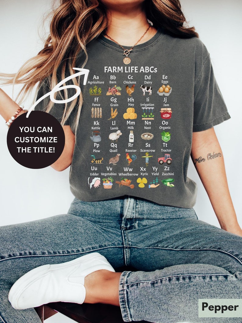May include: A grey t-shirt with a graphic of farm-related items and the text "FARM LIFE ABCS". Each item is paired with a letter of the alphabet and a word describing the item. For example, "Aa Agriculture".
