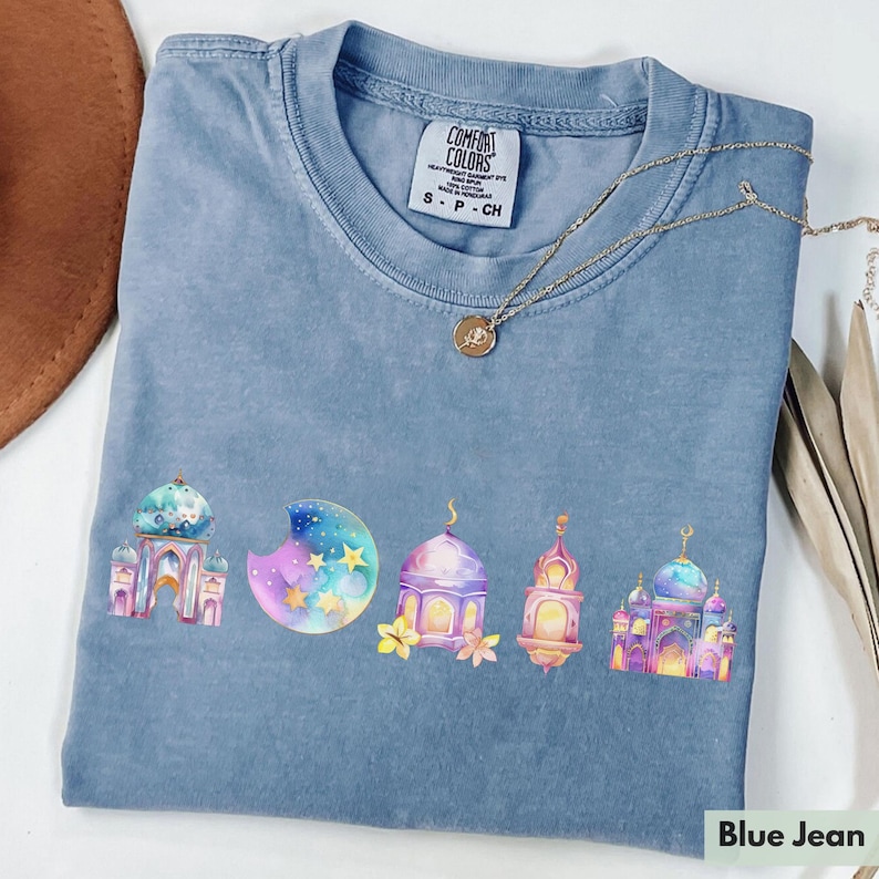 A blue T-shirt with a watercolor design on it