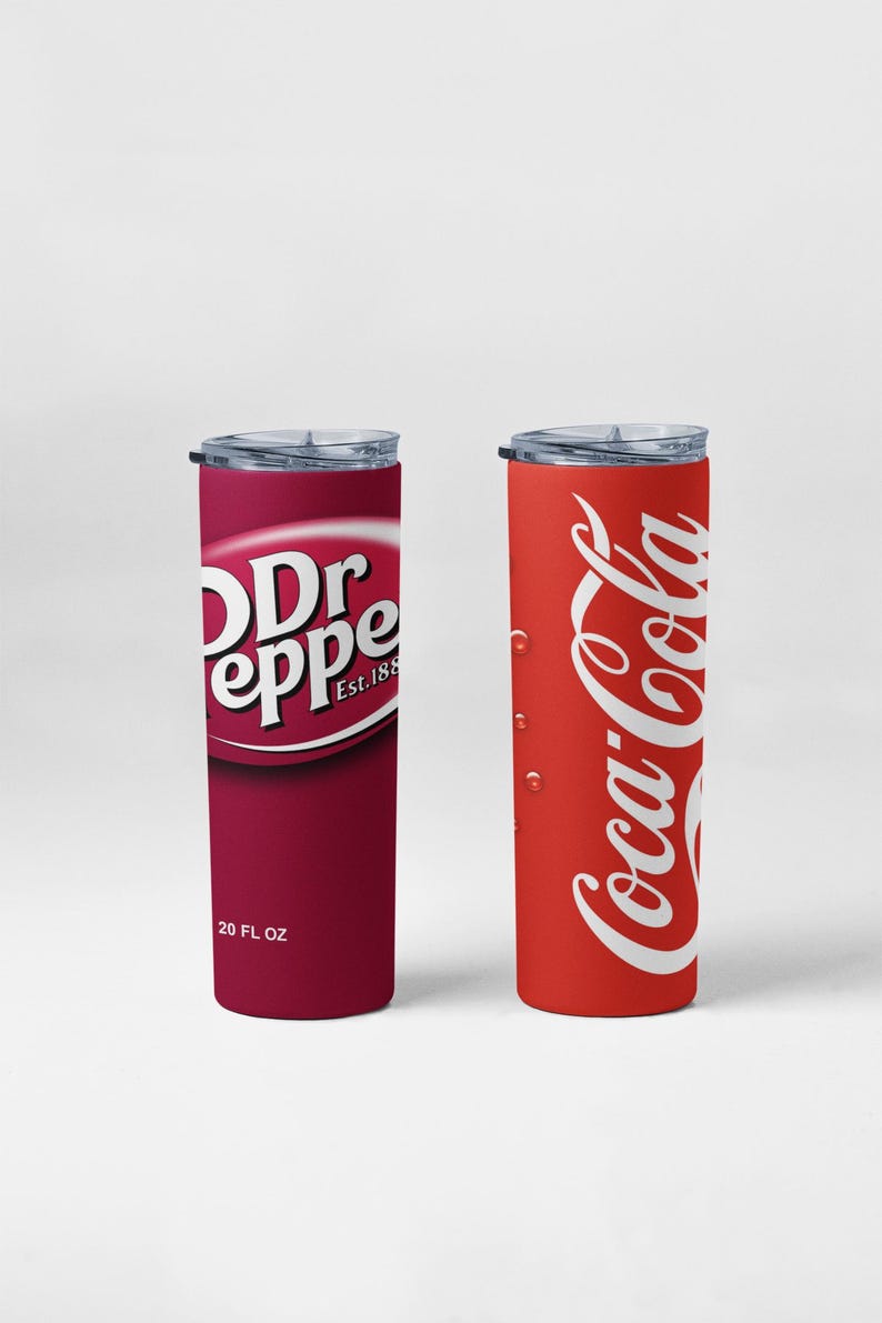 May include: Two insulated tumblers, one with a Dr Pepper logo and the other with a Coca-Cola logo. The Dr Pepper tumbler is burgundy with white text and reads "20 FL OZ". The Coca-Cola tumbler is red with white text and has water droplets.