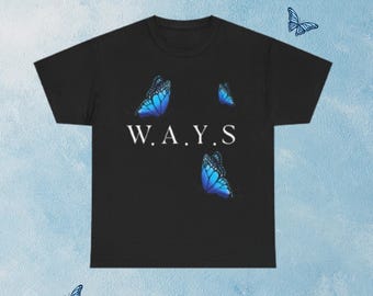 May include: A black short-sleeve t-shirt featuring the white text W.A.Y.S centered on the chest. The shirt is decorated with several blue butterfly graphics positioned around the text, showcasing vibrant blue and black wing patterns.