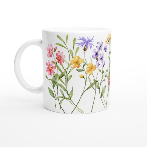 Keramiktasse mit umlaufendem Blumenmuster