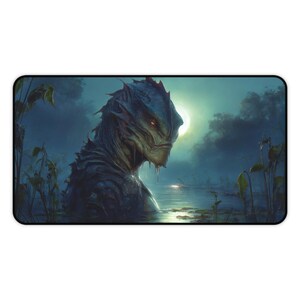 May include: A rectangular mousepad featuring a fantasy illustration of a creature emerging from water. The creature has a reptilian appearance with a dark, textured skin and glowing orange eyes. The background depicts a moonlit swamp.