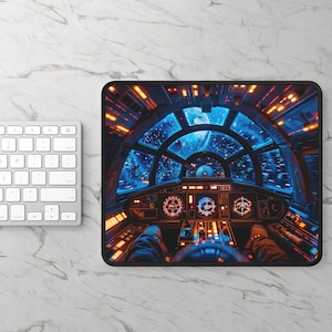 May include: A blue and orange spaceship cockpit mousepad with a view of space through the windows. The cockpit features a steering wheel, control panels, and a view of the stars.