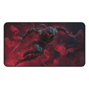 May include: A rectangular mousepad featuring a dynamic illustration of a ninja in mid-air, wielding two swords. The ninja is clad in dark armor and a hooded cloak, with glowing red eyes. The background is a swirling, smoky red.