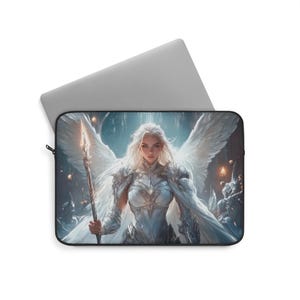 May include: Laptop sleeve featuring a fantasy illustration of a woman with white hair, large white wings, and a spear. The artwork is set against a backdrop of a celestial scene with a soft, ethereal glow. The sleeve is black with a zipper.