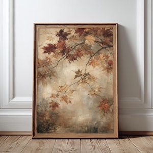 Peut inclure: Une impression d'art encadrée rectangulaire représentant une peinture de branches d'érable avec des feuilles d'automne dans des tons de rouge profond, orange et jaune doré sur un fond beige et crème doux, dans un cadre en bois brun clair.