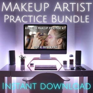 May include: A computer screen displaying a digital download for an airbrush makeup practice kit. The screen shows a model having makeup applied with an airbrush. The text "AIRBRUSH MAKEUP PRACTICE KIT" and "DIGITAL DOWNLOAD" are visible on the screen. The computer is on a white desk with a keyboard, a plant, and other items.