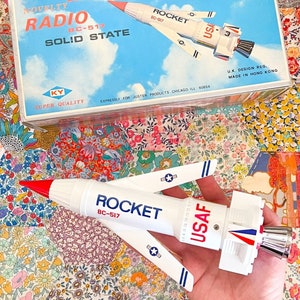 Vintage Novelty Radio Rocket BC-517 Solid State Radio - 1960s - Made in hong Kong UK Designed - with box, base stand and original battery.