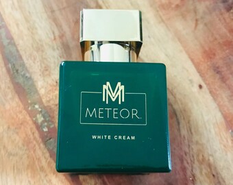 White cream. Eau de parfum. M E T E O R.