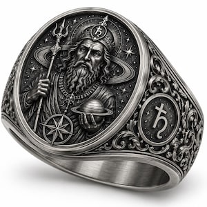 May include: A silver-toned metal ring featuring an oval face with a relief carving of a bearded figure holding a trident and a planet. The background includes stars and a ringed planet. The side of the ring displays an astrological symbol for Saturn.