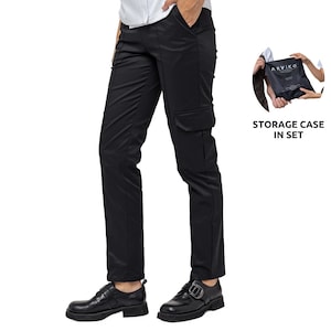 May include: Black cargo pants with a large pocket on the right leg. The pants are worn by a person with black shoes. The image also shows a black storage case with the text "ARVIKO" printed on it. The text "STORAGE CASE IN SET" is also included in the image.